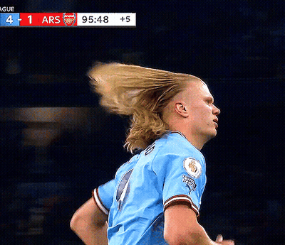 Soccer Player In Blue Pointing Up GIF