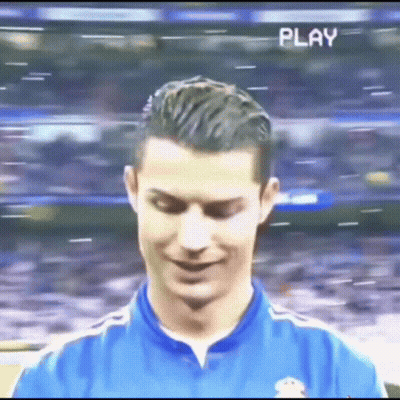 Soccer Player In Blue Shirt Smiling With Play GIF