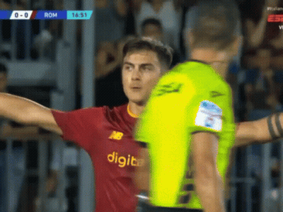 Soccer Player In Digital Jersey Next To Referee GIF