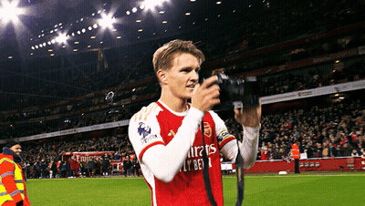 Soccer Player In Emirates Fly Bet Jersey Taking Picture GIF