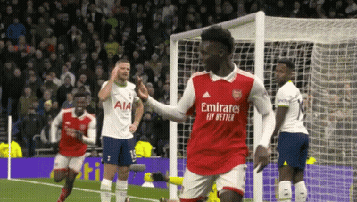 Soccer Player in Emirates Fly Better Jersey Celebrating Goal