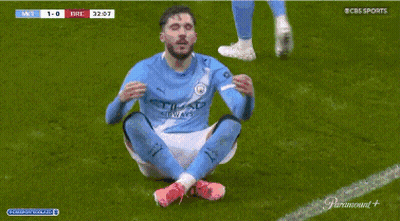 Soccer Player In Etihad Shirt Sitting On Ground GIF