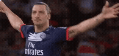 Soccer Player In Fly Emirates Jersey Arms Outstretched GIF