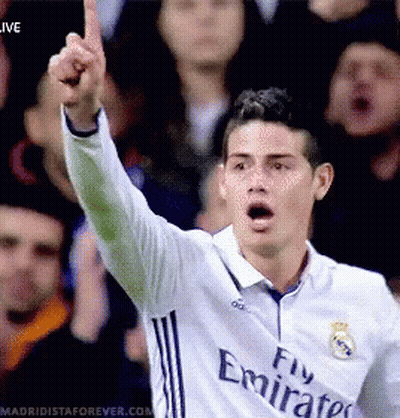 Soccer Player In Fly Emirates Jersey Raises Fist GIF