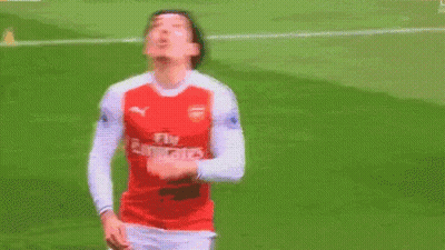 Soccer Player In Fly Emirates Jersey Standing On Field GIF