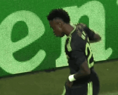 Soccer Player in Front of Heineken Billboard