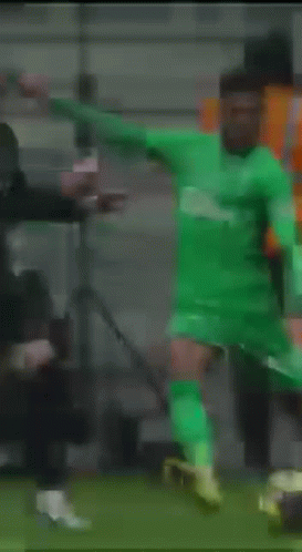 Soccer Player In Green Jersey Kicking Soccer Ball GIF