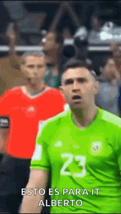 Soccer Player In Green Jersey Number 23 In Front Of Crowd GIF