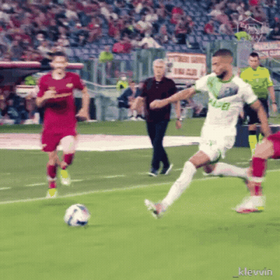Soccer Player In Green Jersey With Letter E Kicking Ball GIF