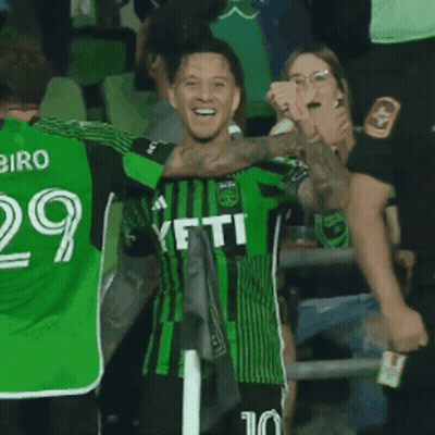 Soccer Player In Green Yeti Jersey Celebrates With Teammates GIF