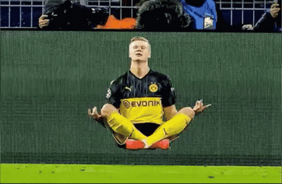 Soccer Player In Lotus Position With Crowd Watching GIF