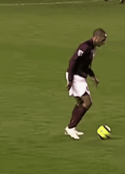 Soccer Player In Maroon Jersey And White Shorts Running GIF