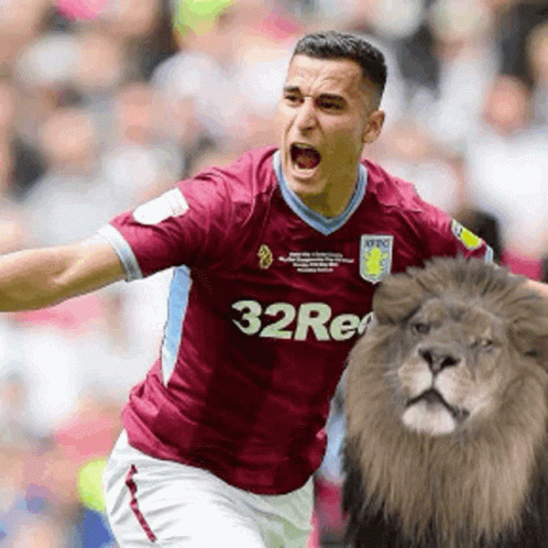 Soccer Player In Maroon Jersey With 32Re GIF
