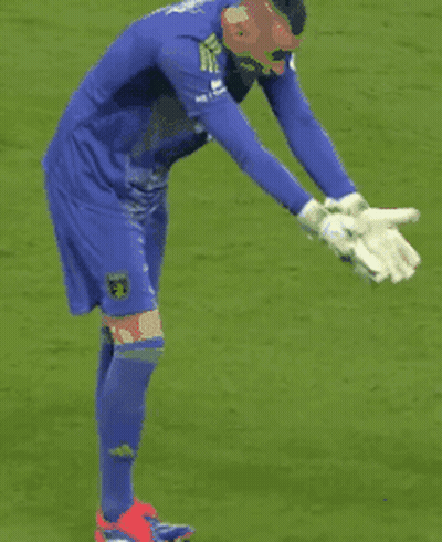 Soccer Player In Mask And Gloves Kneeling GIF