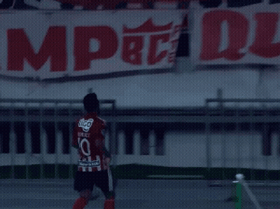 Soccer Player In Number 10 Jersey In Front Of Banner GIF