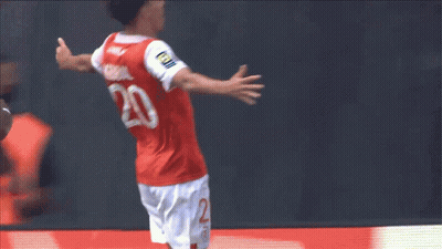 Soccer Player In Number 20 Jersey Jumping GIF