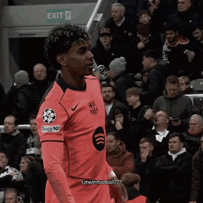 Soccer Player In Pink Jersey Number 10 By Exit Sign GIF
