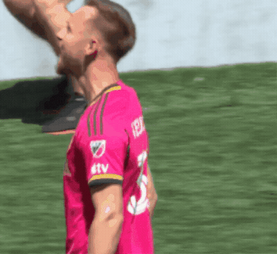 Soccer Player In Pink Jersey With TTV On Sleeve GIF