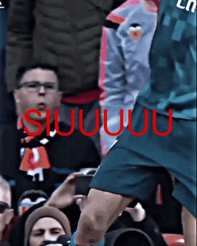 Soccer Player In Purple Fly Emirates Jersey Laughing In Front Of Crowd GIF