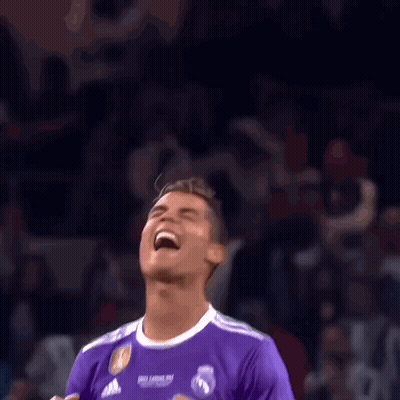 Soccer Player In Purple Fly Emirates Jersey Laughing In Front Of Crowd GIF