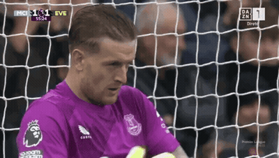 Soccer Player In Purple Jersey At Net GIF