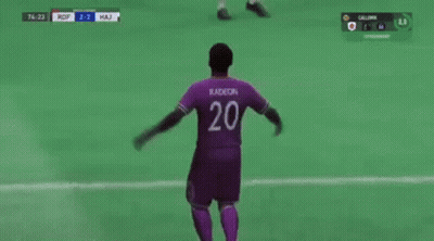 Soccer Player In Purple Jersey Celebrating Goal GIF