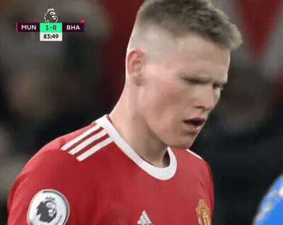 Soccer Player In Red Adidas Jersey Looking Down GIF
