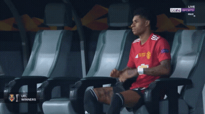Soccer Player In Red Adidas Looking Down GIF