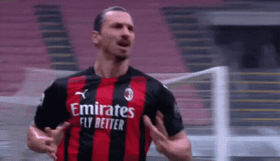 Soccer Player In Red And Black Jersey Saying Emirates Fly Better GIF