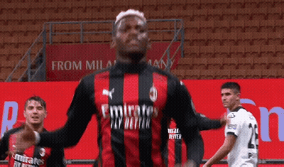 Soccer Player In Red And Black Jersey With Emirates GIF