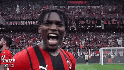 Soccer Player In Red And Black Puma Jersey Screaming GIF