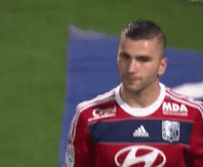 Soccer Player In Red And Blue Jersey With Letter H GIF