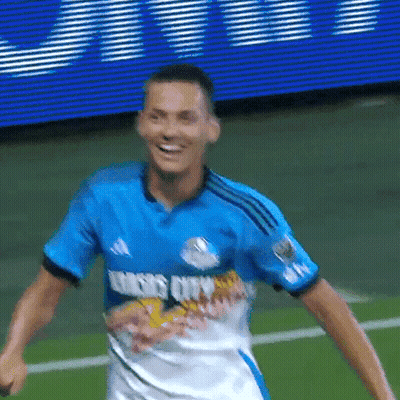 Soccer Player In Red And Blue Striped Jersey With O GIF