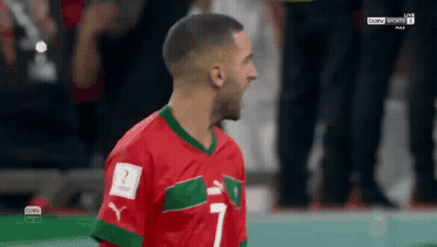 Soccer Player In Red And Green Jersey Number 7 GIF