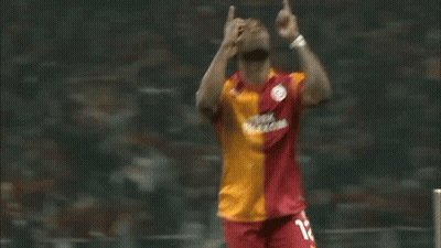Soccer Player In Red And Orange Jersey Number 12 GIF