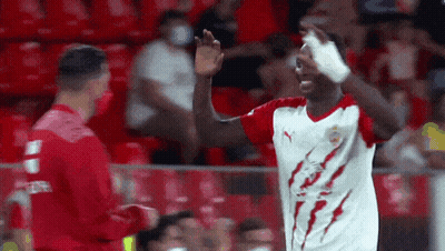Soccer Player In Red And White Jersey With Lightning Bolt GIF