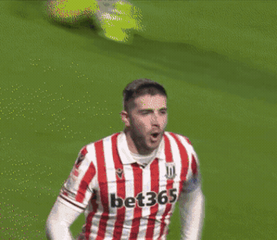 Soccer Player In Red And White Striped Jersey Number 23 GIF