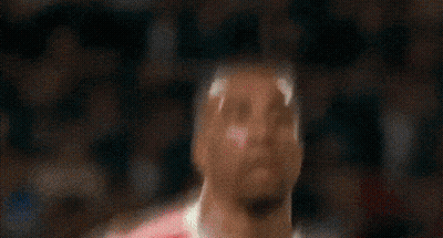 Soccer Player In Red And White Uniform Looking Up GIF