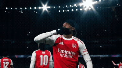 Soccer Player In Red Emirates Fly Better Jersey Celebrates GIF