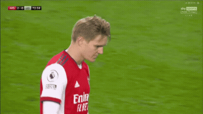 Soccer Player In Red Emirates Fly Better Shirt Talking To Another Player GIF