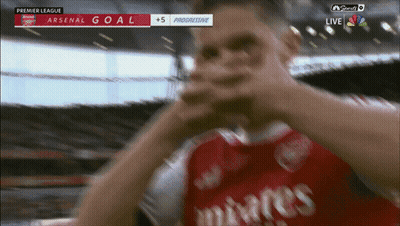 Soccer Player In Red Emirates Jersey Celebrates Goal GIF