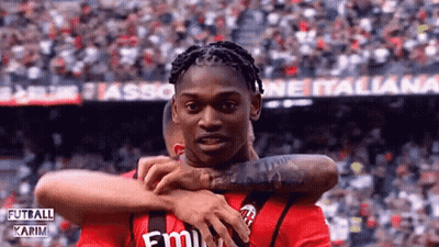 Soccer Player In Red Emirates Shirt Hugging Another GIF