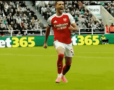Soccer Player In Red Jersey Celebrating Goal GIF