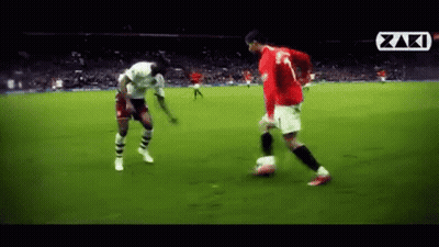 Soccer Player In Red Jersey Kicking Soccer Ball GIF