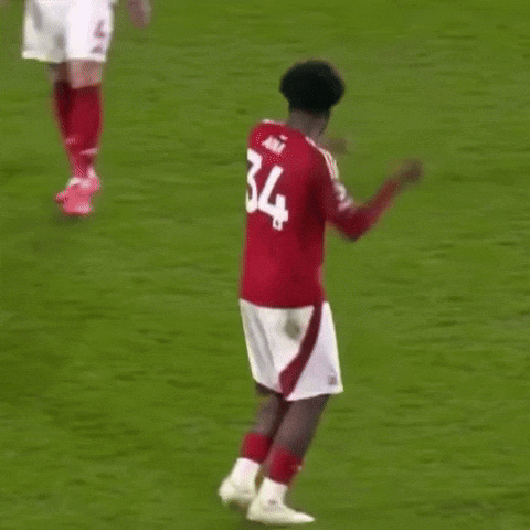 Soccer Player In Red Jersey Number 34 Dancing On Field GIF