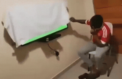 Soccer Player In Red Jersey Pointing Up GIF
