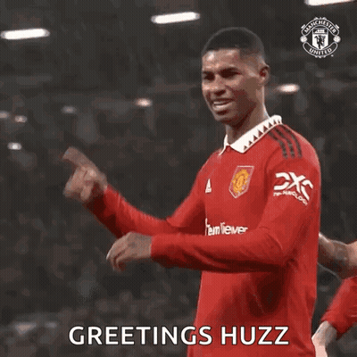 Soccer Player In Red Jersey Saying Greetings GIF