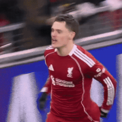 Soccer Player In Red Jersey Saying Standard Chartered GIF