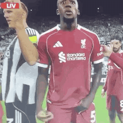 Soccer Player In Red Jersey Saying Standard Chartered GIF