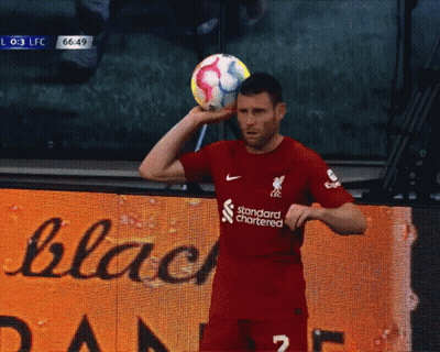 Soccer Player In Red Jersey With Standard Chartered GIF